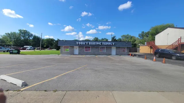 a view of a patio with a table and chairs under an umbrella
