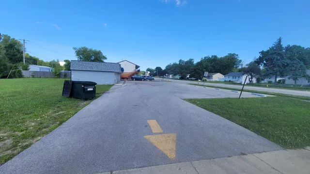a view of a park with large trees