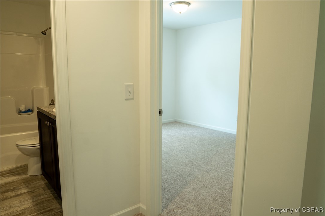 5726 Clay Bank Road Gloucester, VA 23061 - Photo 32 of 40 Corridor with dark carpet