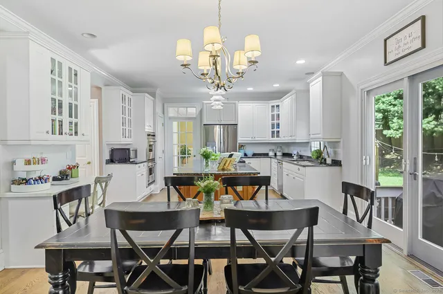 a view of a dining room with furniture window and outside view