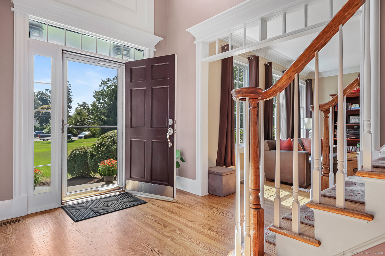 305 South Gate Lane Fairfield, CT 06890 - Photo 2 of 40 a view of an entryway with wooden floor and door