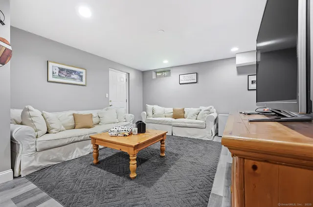 a living room with furniture and a table