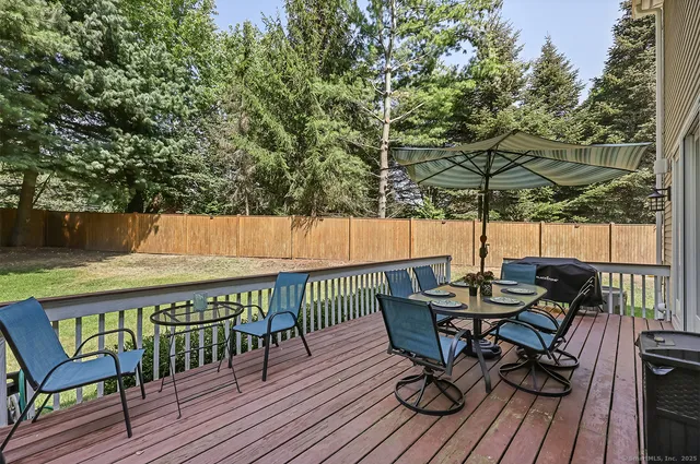 a view of table and chairs on roof deck