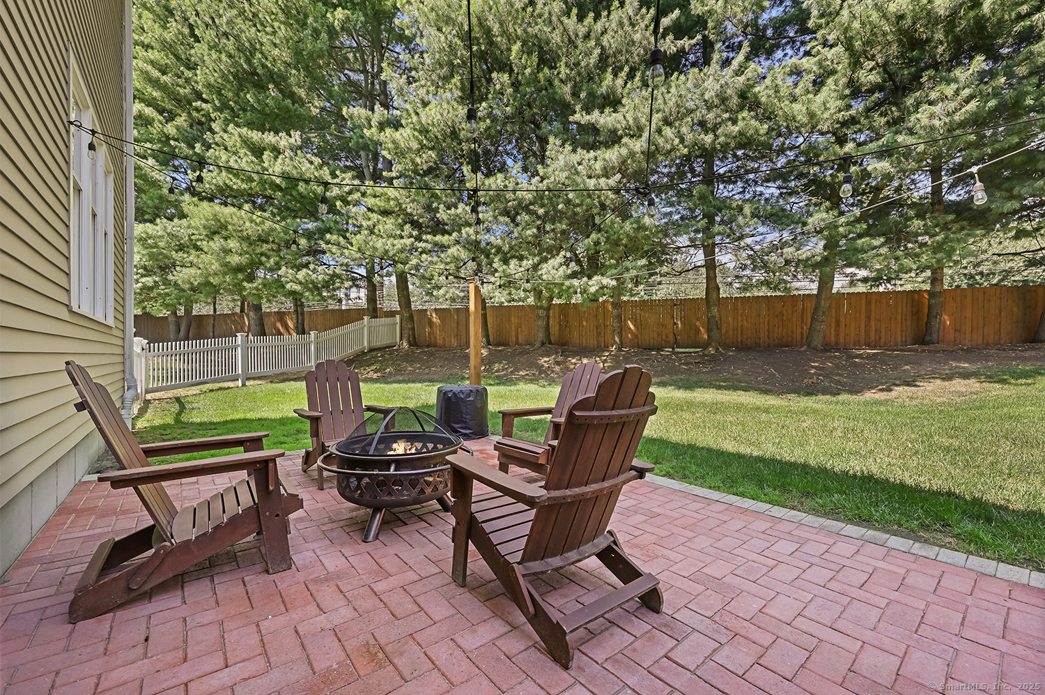 305 South Gate Lane Fairfield, CT 06890 - Photo 37 of 40 a view of a backyard with sitting area
