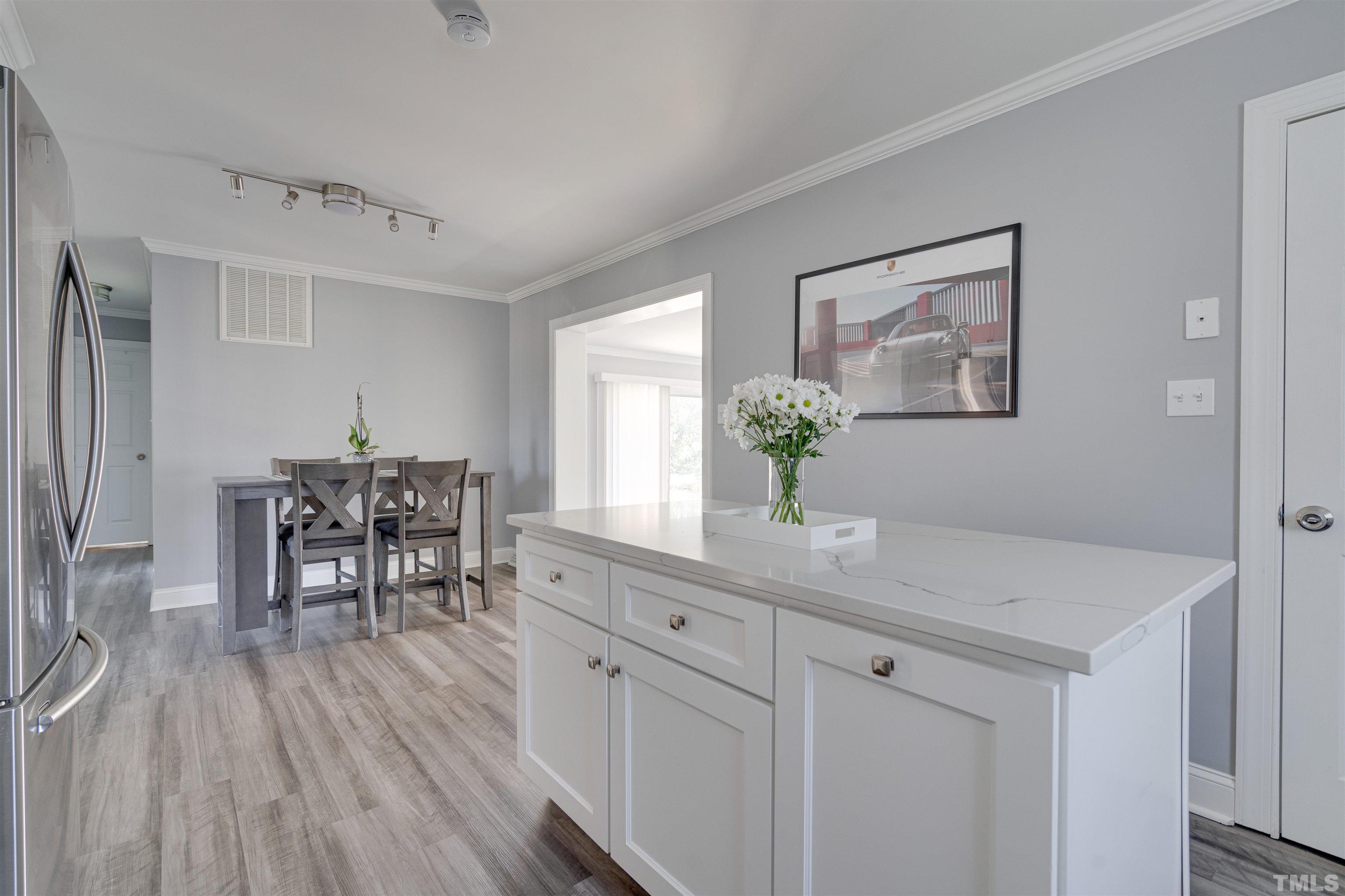 4124 Green Road Raleigh, NC 27604 - Photo 11 of 18 a room with furniture and wooden floor