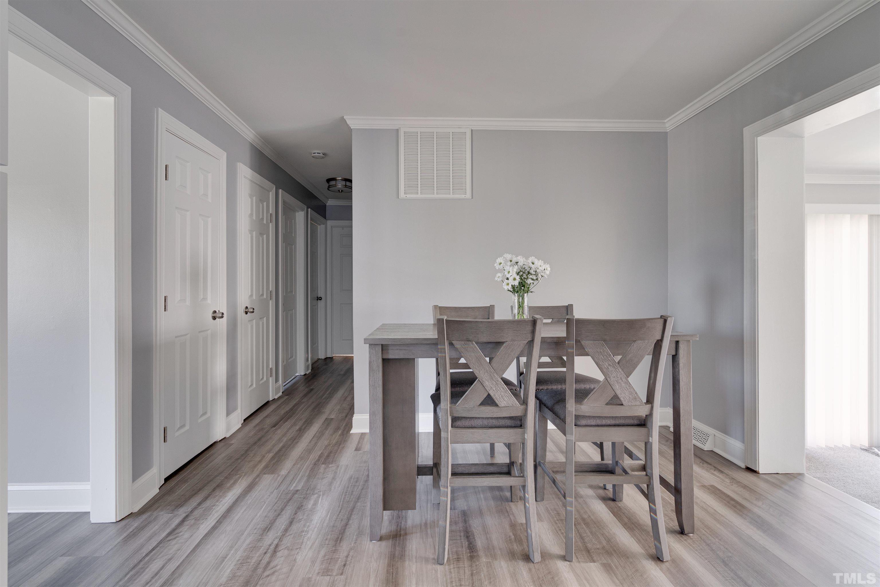 4124 Green Road Raleigh, NC 27604 - Photo 14 of 18 a view of a dining room with furniture and wooden floor