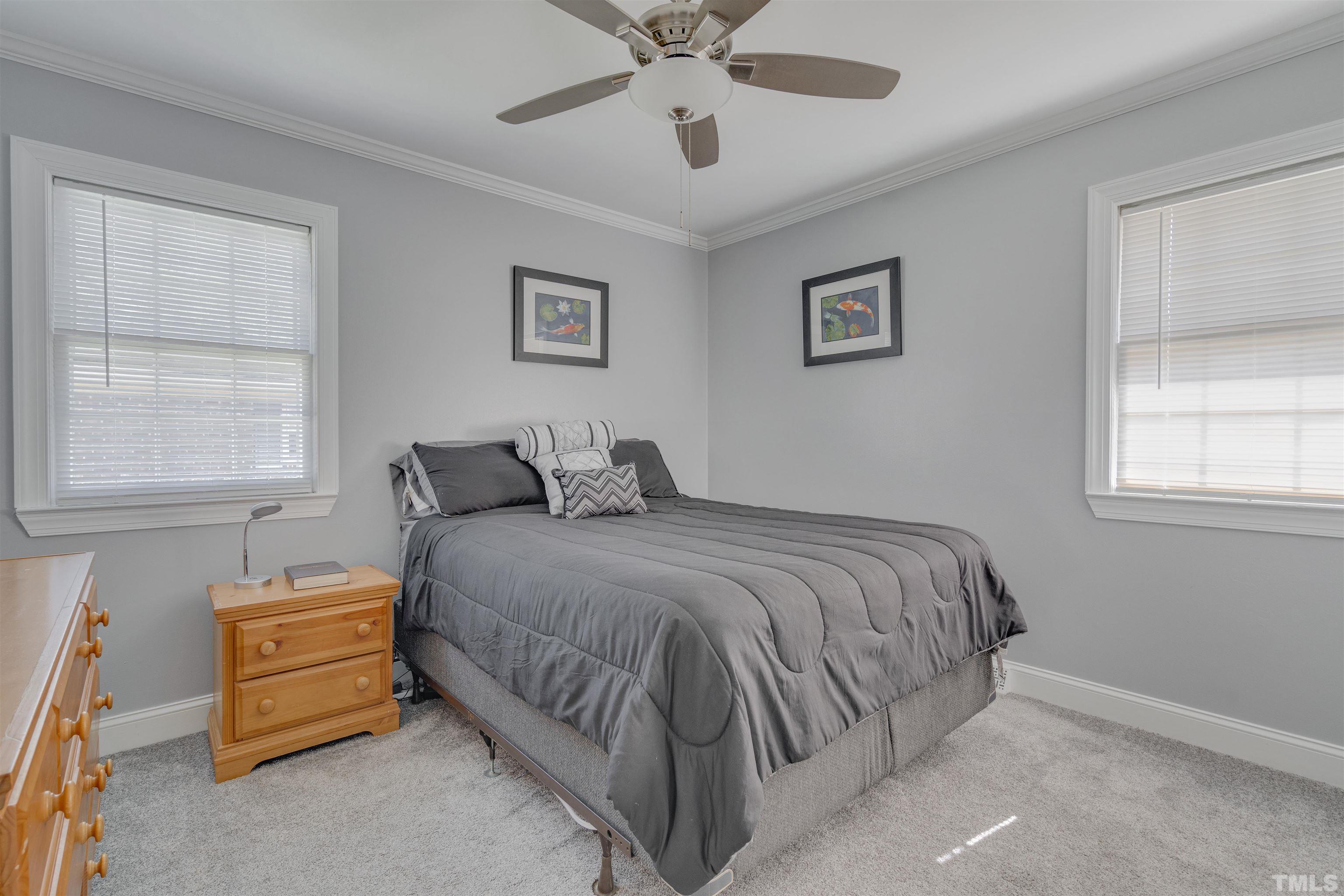4124 Green Road Raleigh, NC 27604 - Photo 15 of 18 a bedroom with a bed and window