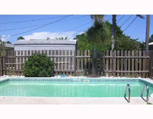 1754 Southeast Lafayette Street Stuart, FL 34997 - Photo 1 of 4 a view of a house with a yard