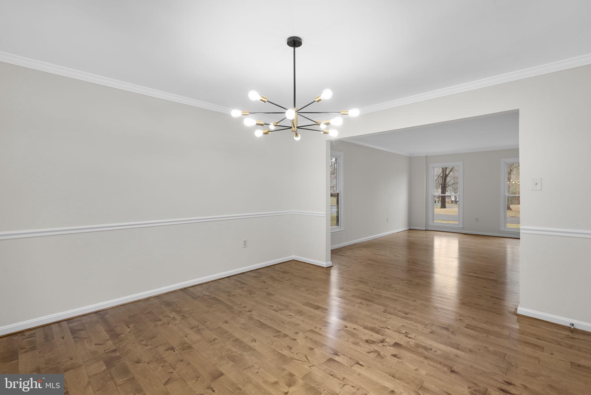 14724 Harvest Lane Silver Spring, MD 20905 - Photo 11 of 53 wooden floor in an empty room with a window