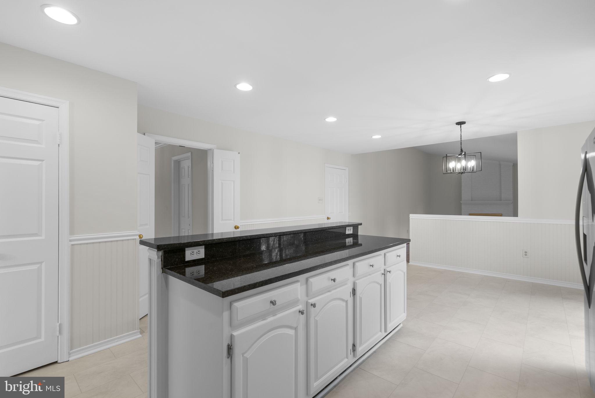 14724 Harvest Lane Silver Spring, MD 20905 - Photo 15 of 53 a kitchen with a sink and cabinets