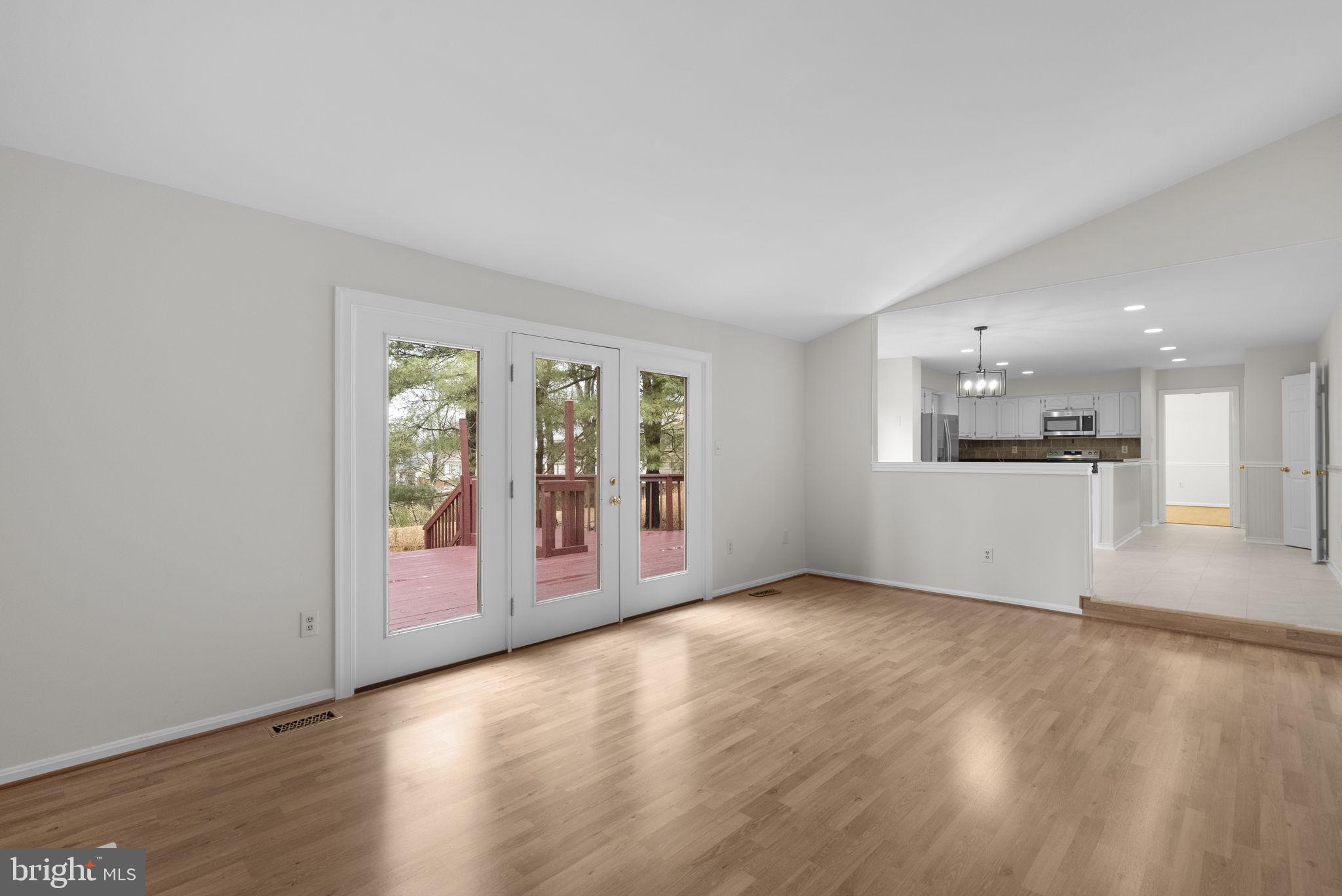 14724 Harvest Lane Silver Spring, MD 20905 - Photo 23 of 53 an empty room with wooden floor and windows