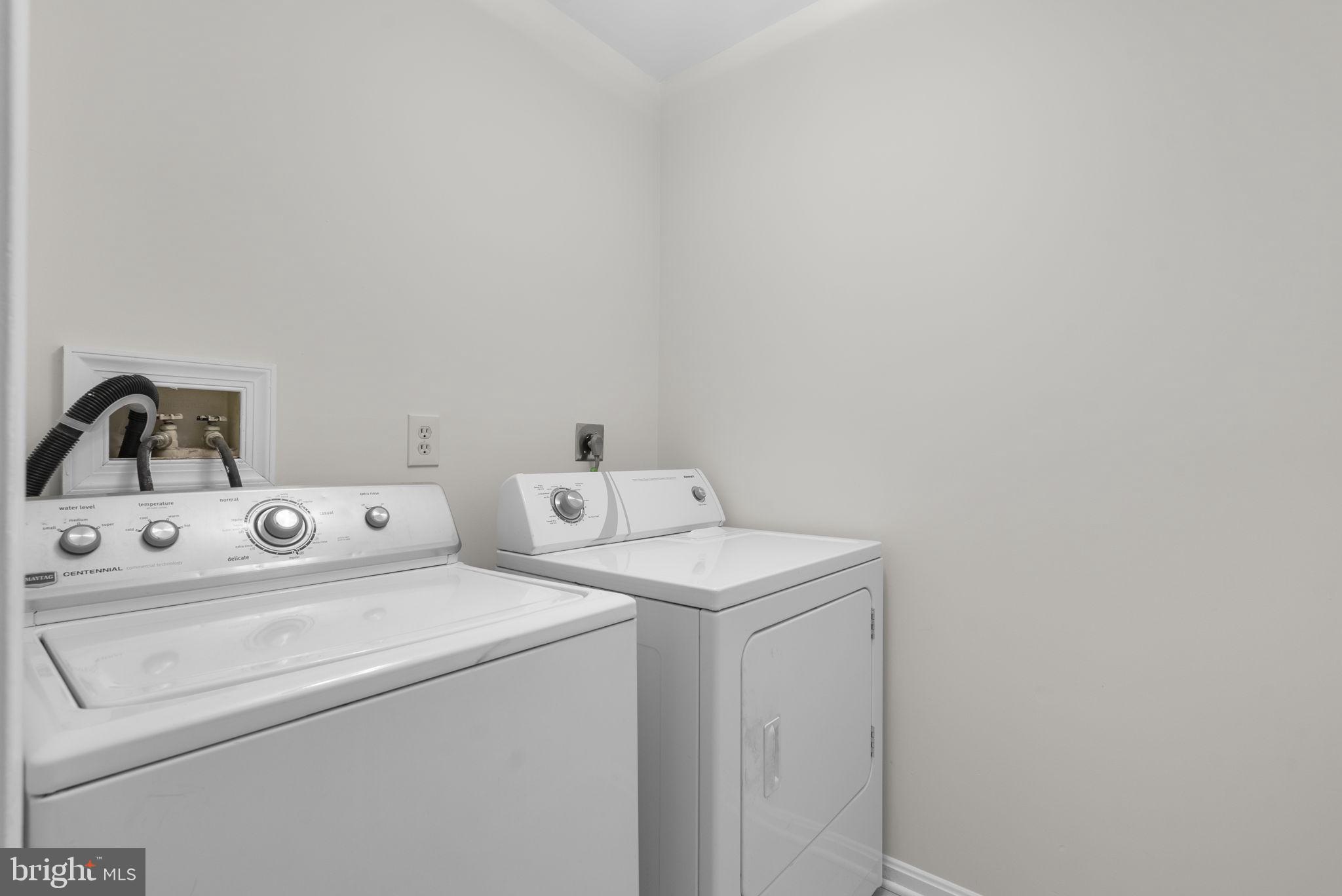 14724 Harvest Lane Silver Spring, MD 20905 - Photo 24 of 53 a utility room with dryer and washer