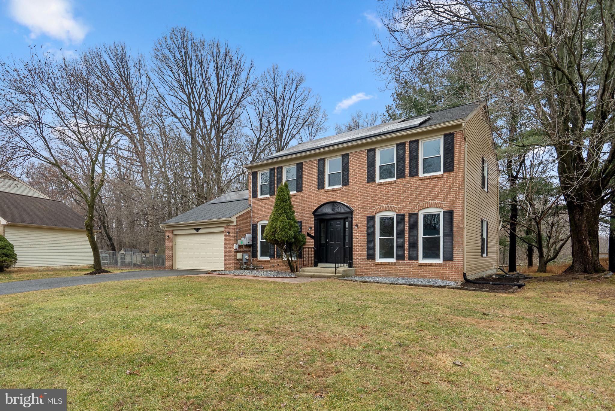 14724 Harvest Lane Silver Spring, MD 20905 - Photo 3 of 53 a front view of a house with a yard