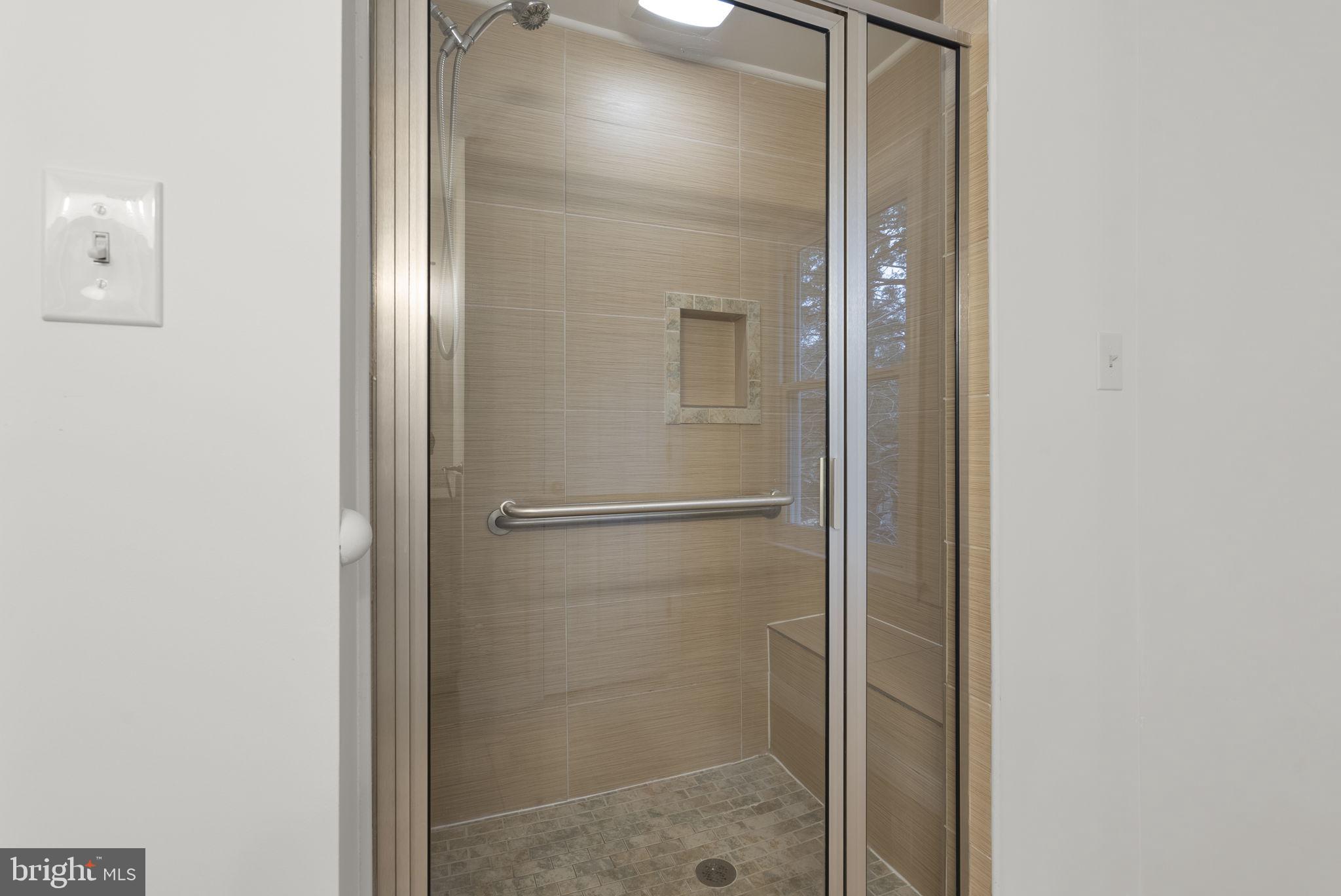 14724 Harvest Lane Silver Spring, MD 20905 - Photo 33 of 53 a bathroom with a glass shower door