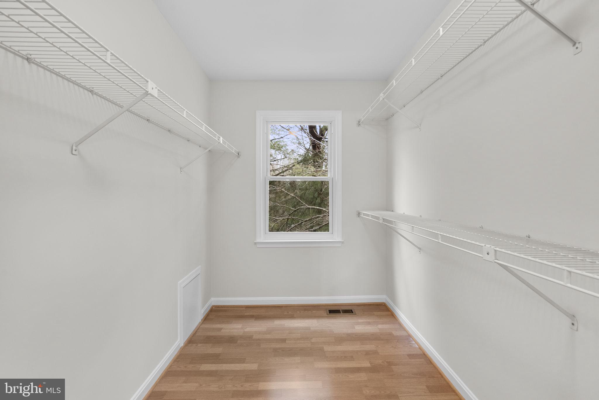 14724 Harvest Lane Silver Spring, MD 20905 - Photo 34 of 53 a view of an empty room with a window and wooden floor