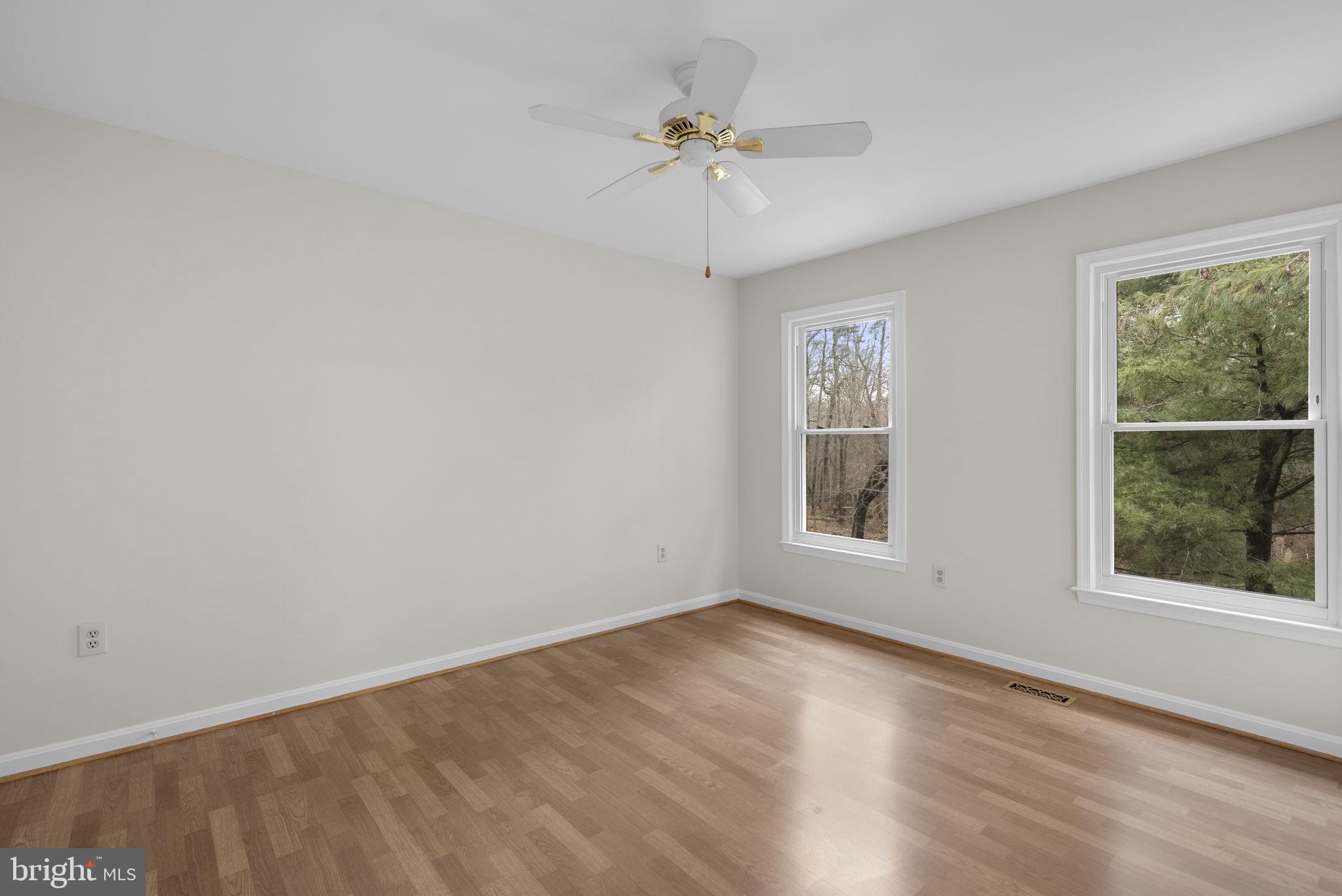 14724 Harvest Lane Silver Spring, MD 20905 - Photo 36 of 53 wooden floor in an empty room with a window