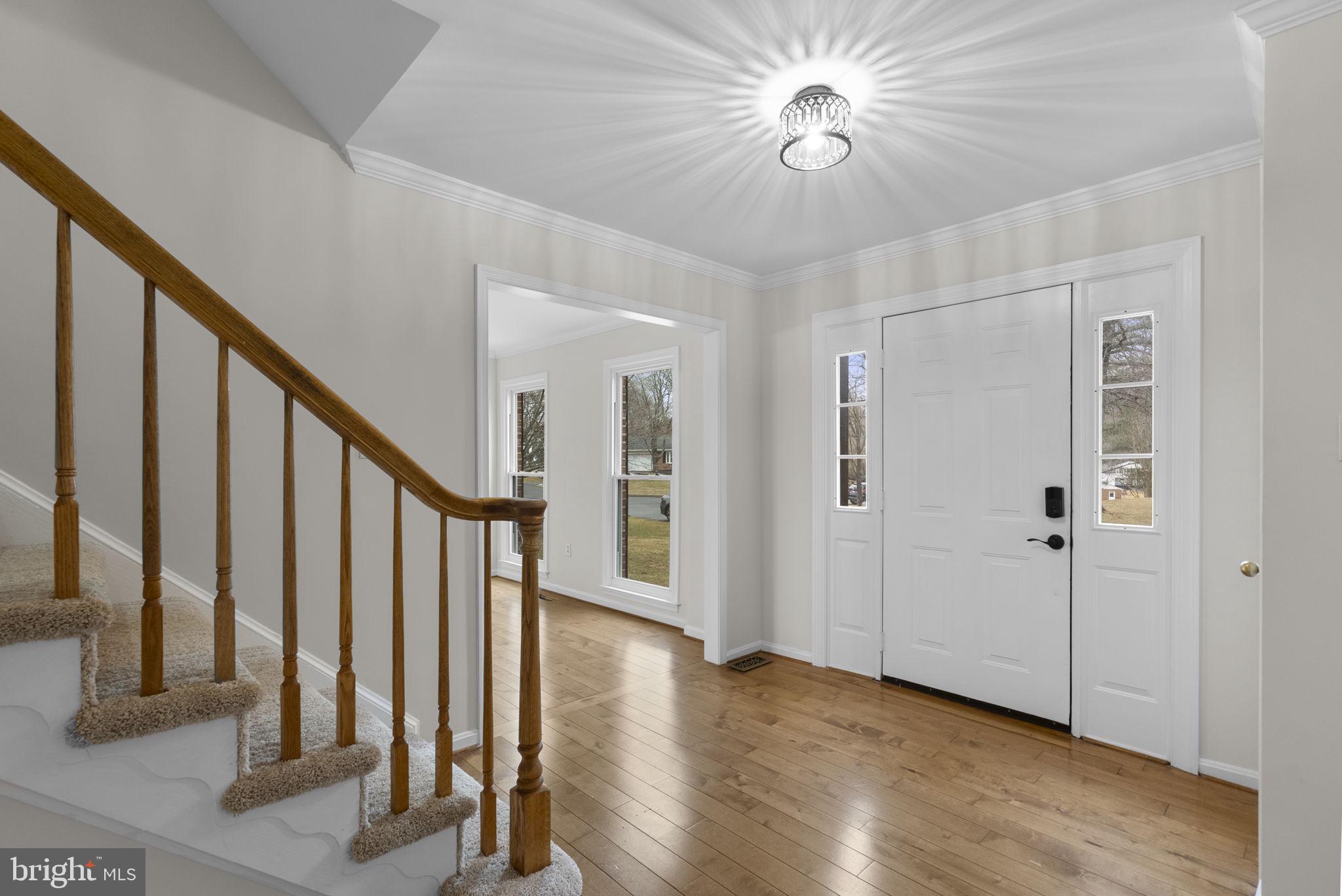 14724 Harvest Lane Silver Spring, MD 20905 - Photo 4 of 53 a view of an entryway with wooden floor
