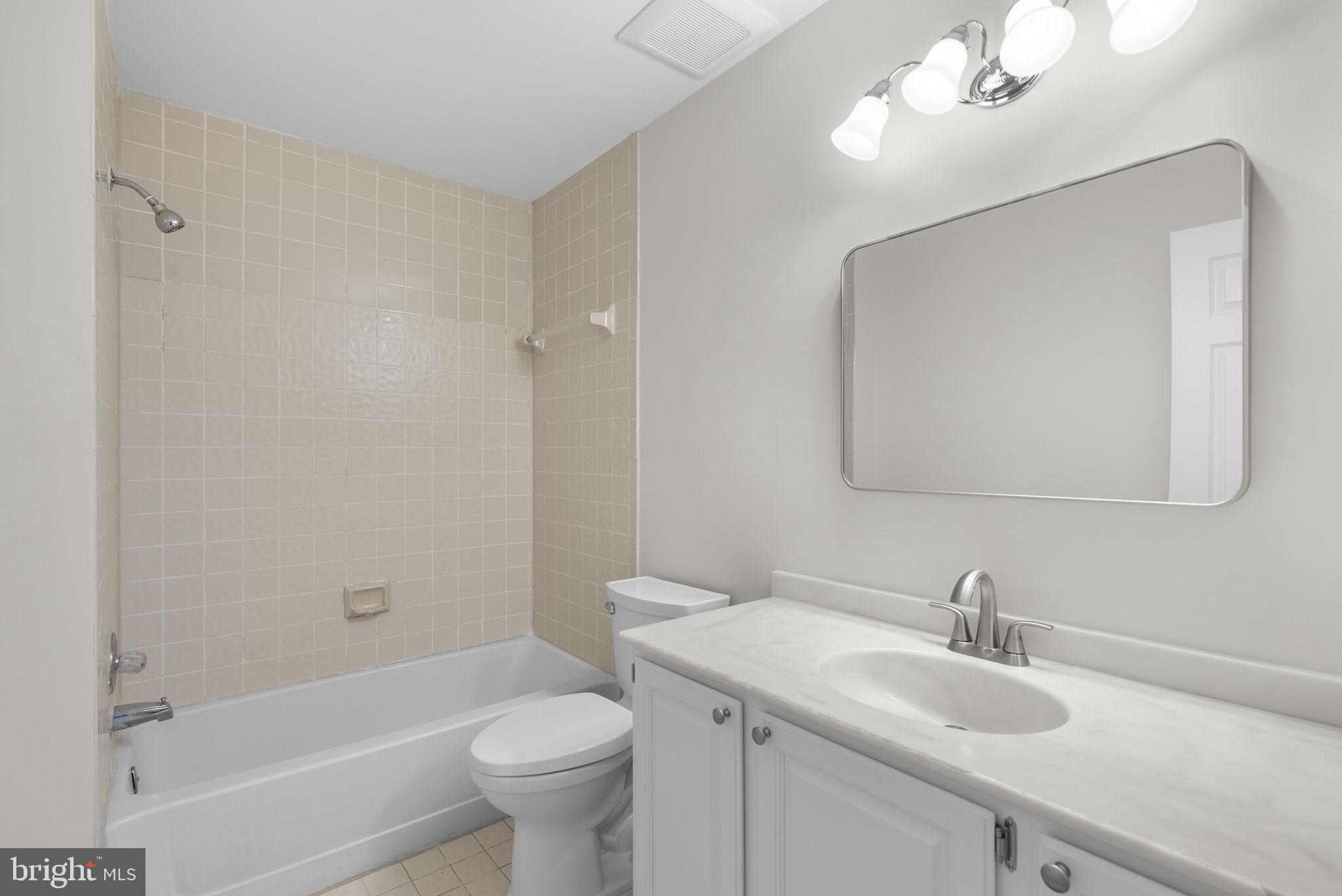 14724 Harvest Lane Silver Spring, MD 20905 - Photo 41 of 53 a bathroom with a sink a toilet and shower