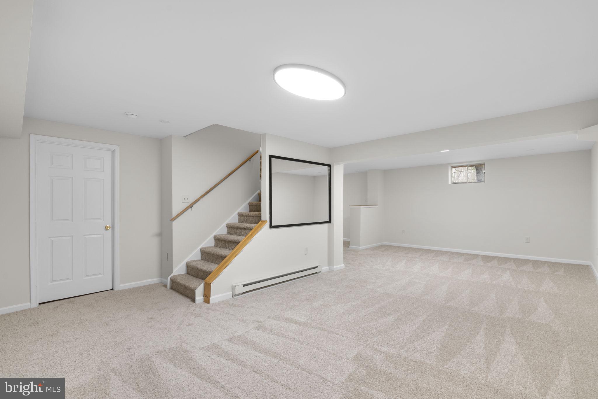 14724 Harvest Lane Silver Spring, MD 20905 - Photo 46 of 53 a view of an empty room with stairs