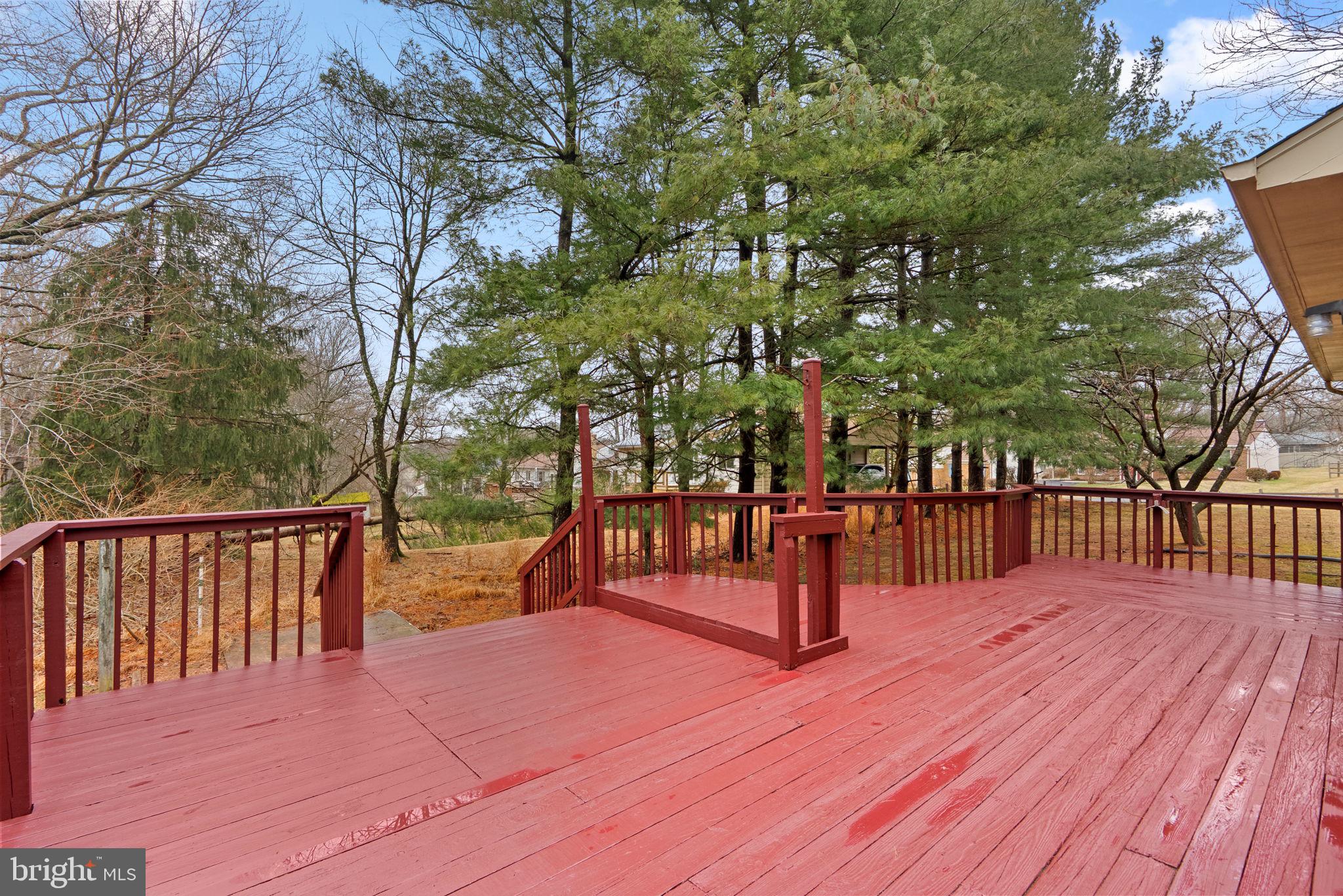 14724 Harvest Lane Silver Spring, MD 20905 - Photo 50 of 53 a view of a pathway with a wrought wooden deck