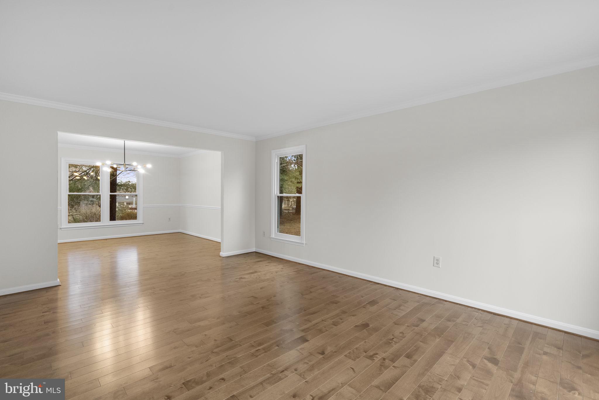 14724 Harvest Lane Silver Spring, MD 20905 - Photo 7 of 53 a view of an empty room with wooden floor and a window