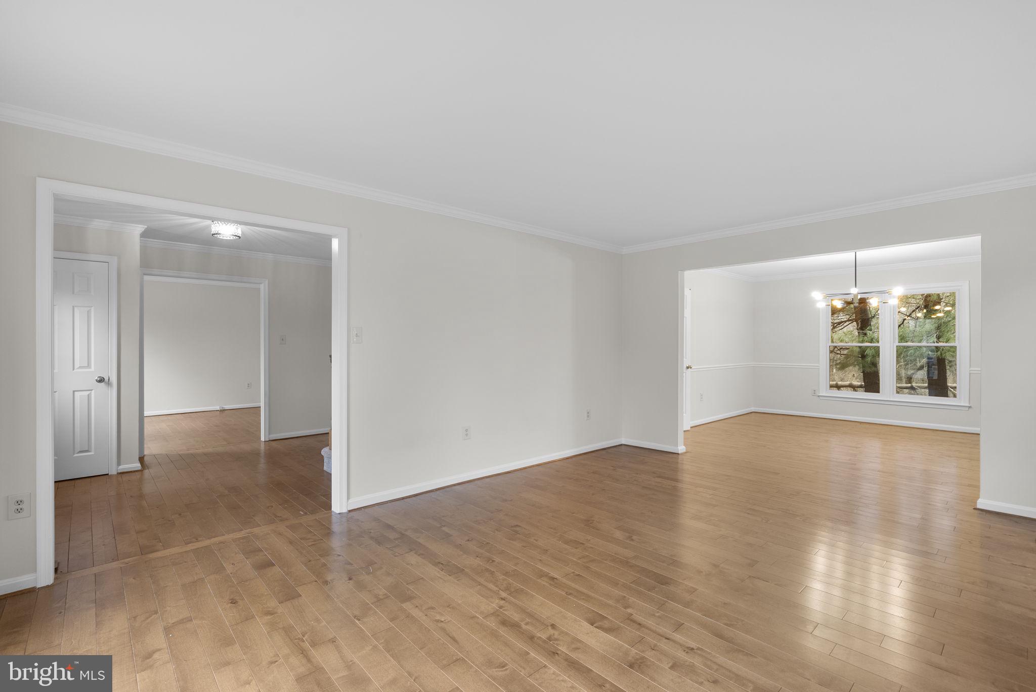 14724 Harvest Lane Silver Spring, MD 20905 - Photo 8 of 53 an empty room with wooden floor and windows