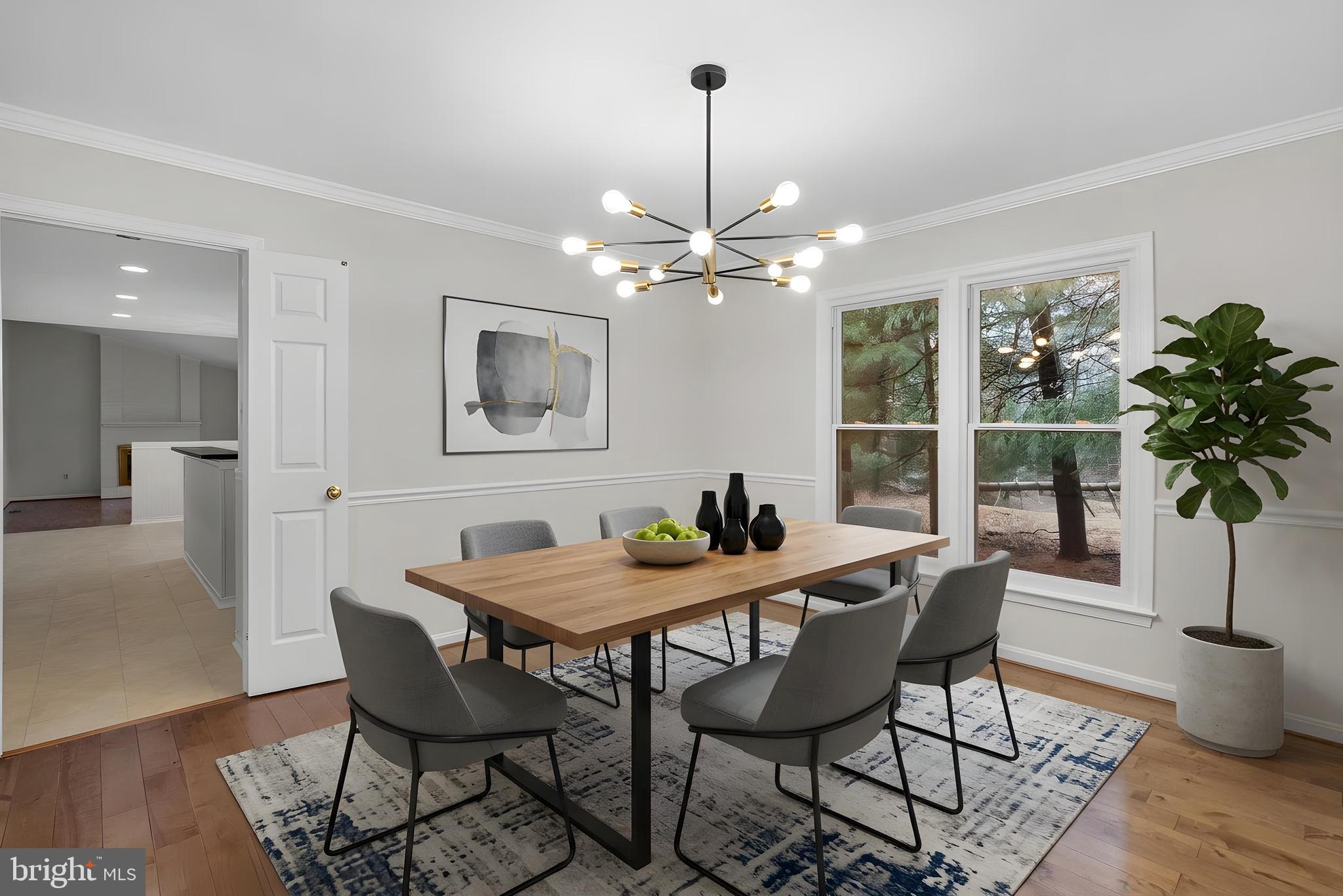 14724 Harvest Lane Silver Spring, MD 20905 - Photo 9 of 53 a dining room with furniture potted plants and wooden floor