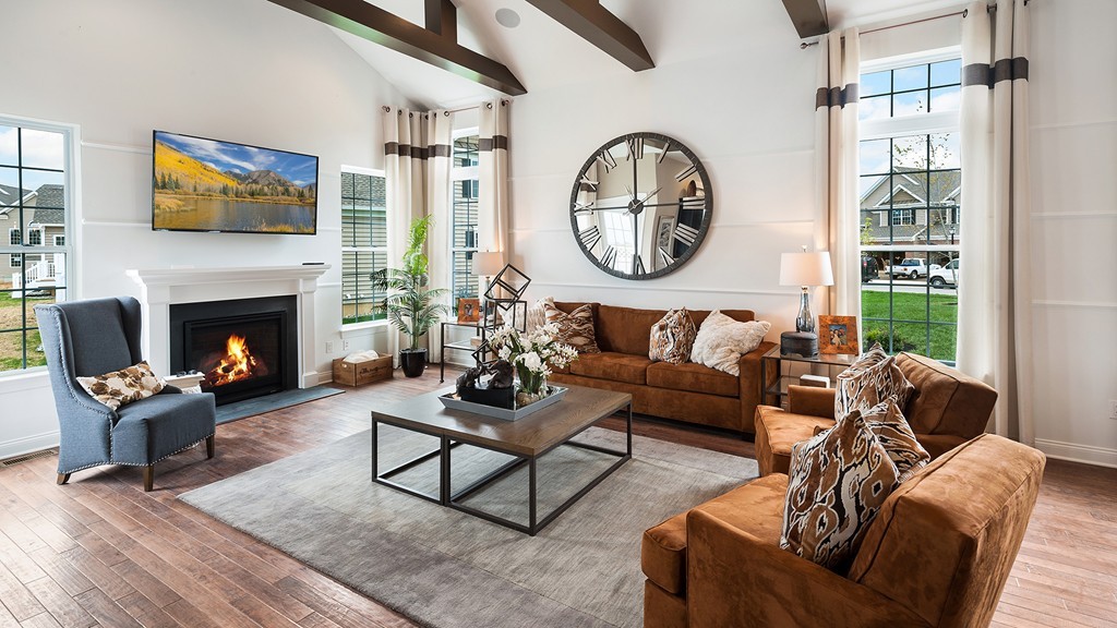 2 Hummingbird Way, Unit 1 Methuen, MA 01844 - Photo 3 of 10 a living room with furniture a clock and a fireplace