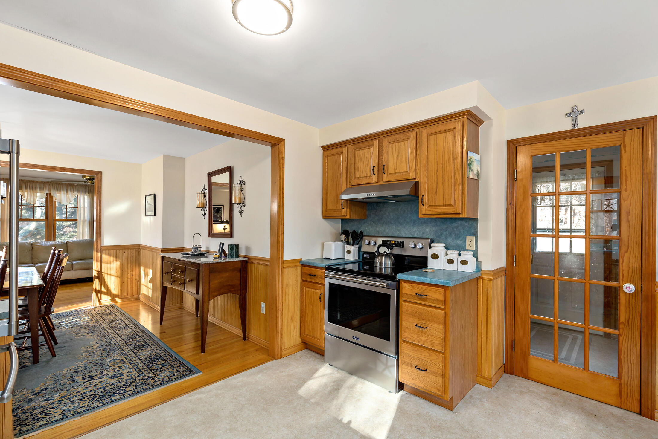 25 Forrest Avenue Eastham, MA 02642 - Photo 15 of 46 a kitchen with stainless steel appliances granite countertop a stove top oven a sink dishwasher and cabinets with wooden floor