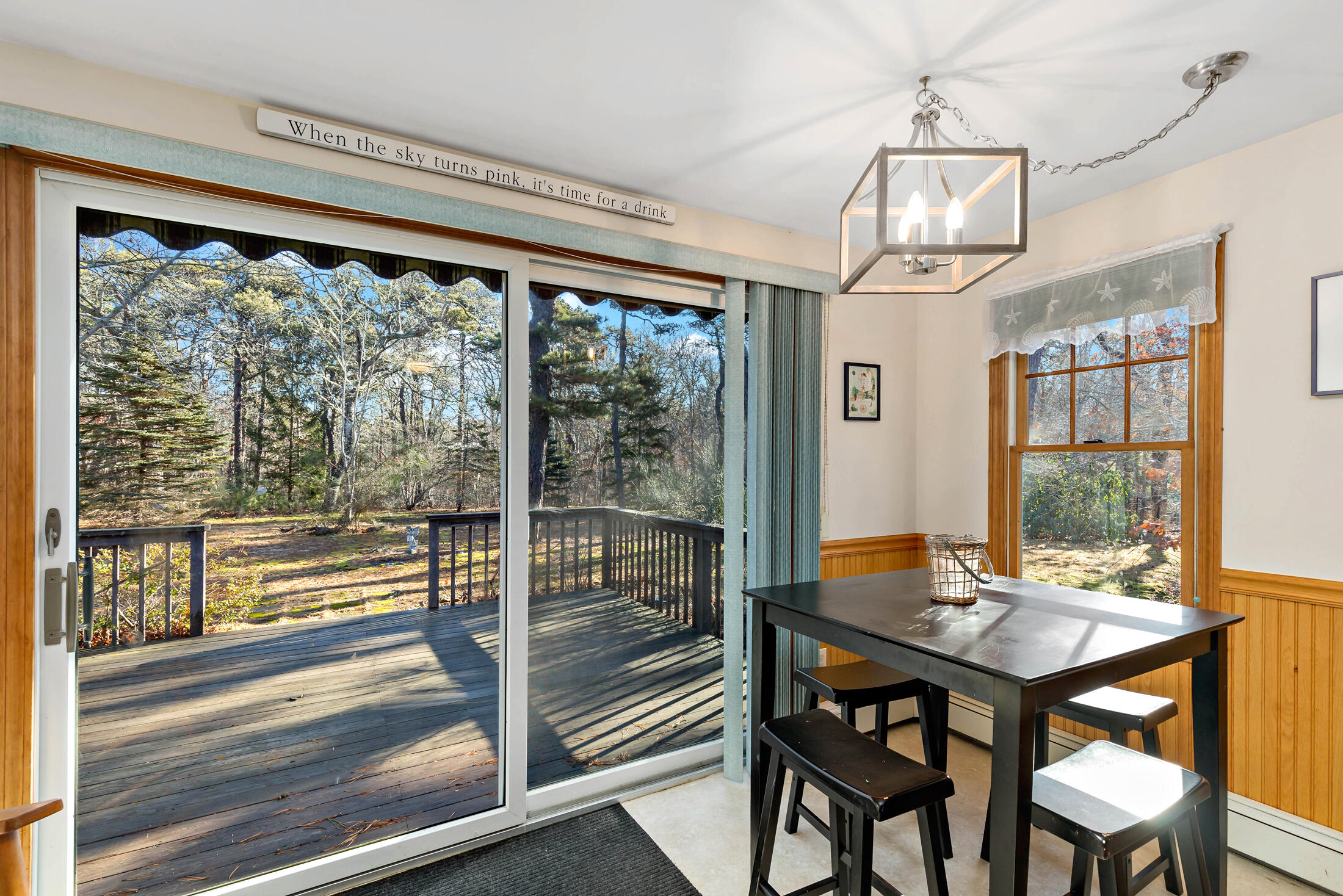 25 Forrest Avenue Eastham, MA 02642 - Photo 17 of 46 a view of a dining room with furniture window and wooden floor