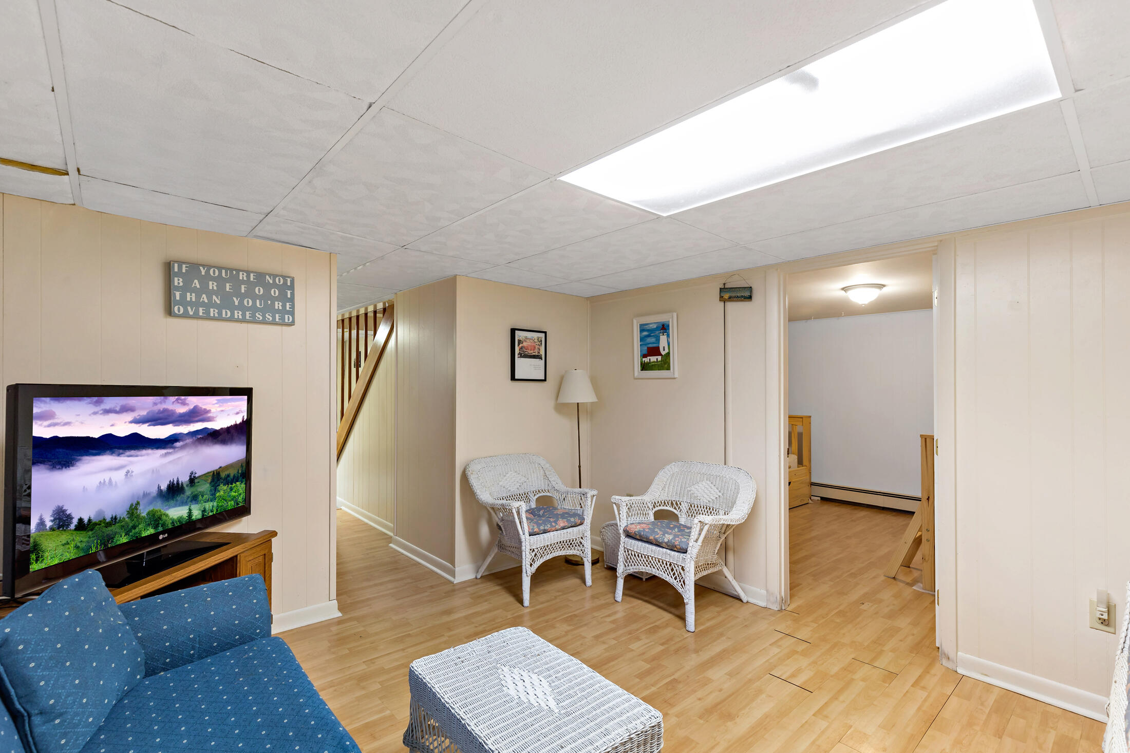 25 Forrest Avenue Eastham, MA 02642 - Photo 38 of 46 a living room with furniture and a flat screen tv