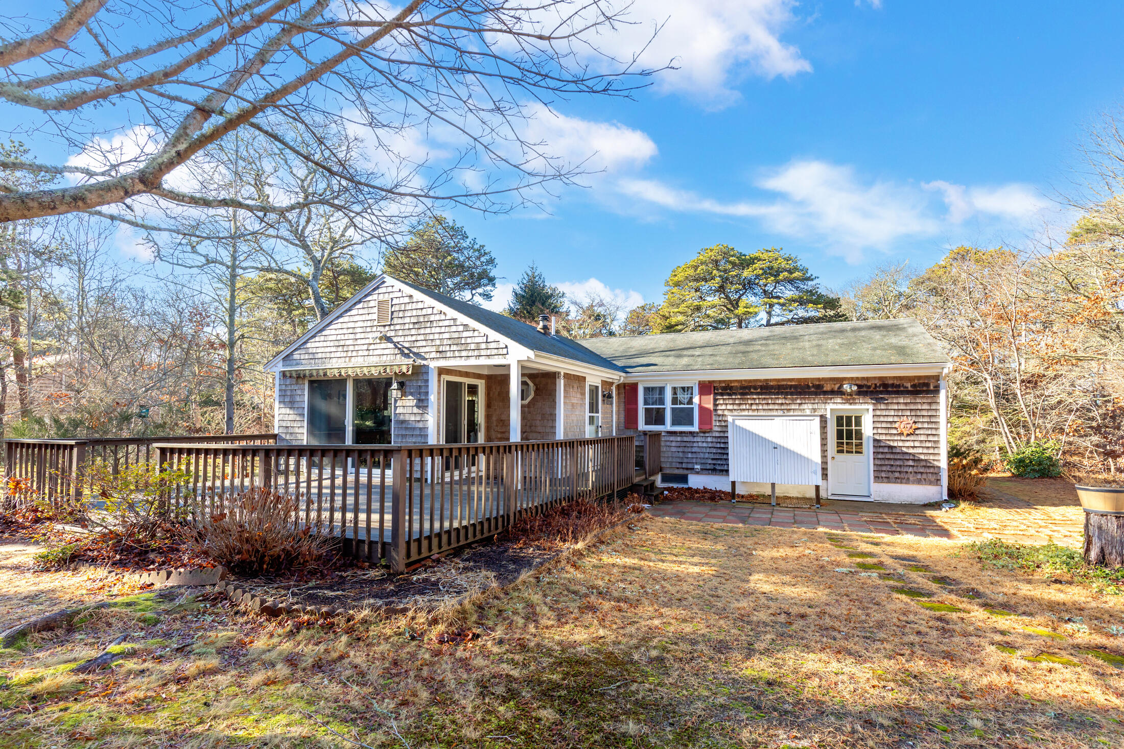 25 Forrest Avenue Eastham, MA 02642 - Photo 10 of 46 a view of a house with a wooden deck and a yard