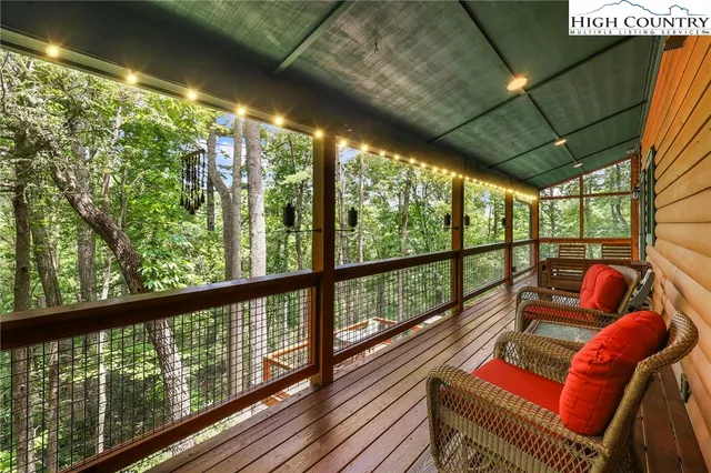 a view of a chairs and table in the balcony