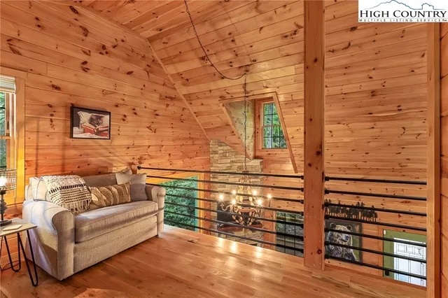 a bedroom with a bed and a mirror