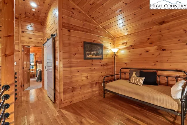 a bedroom with furniture and a chandelier