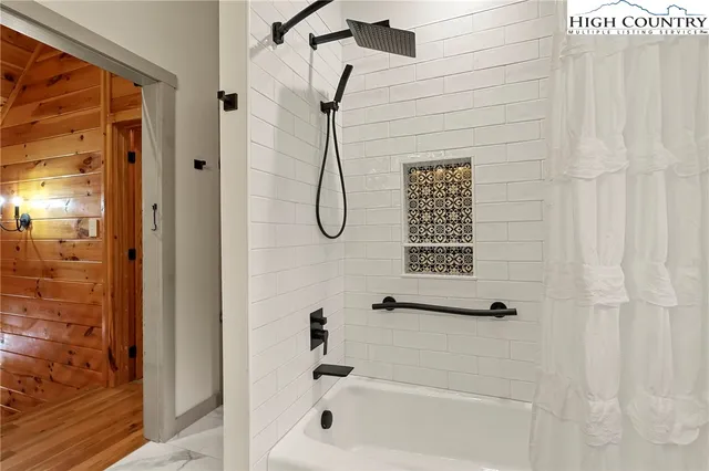 a bathroom with a toilet sink vanity and mirror