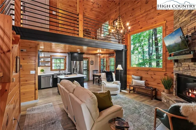 a outdoor living space with patio furniture and a fireplace