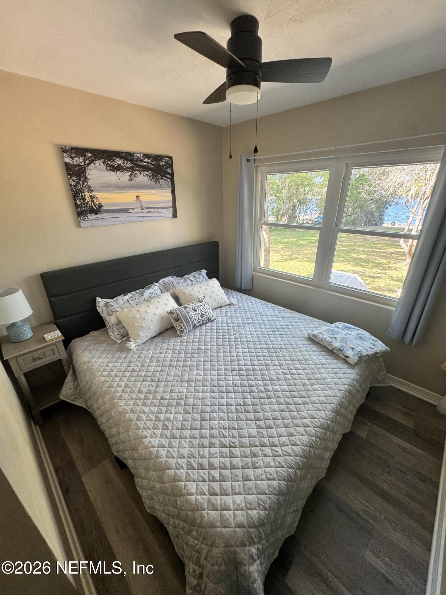 113 Stock Avenue Interlachen, FL 32148 - Photo 15 of 50 a bed sitting in a bedroom next to a window