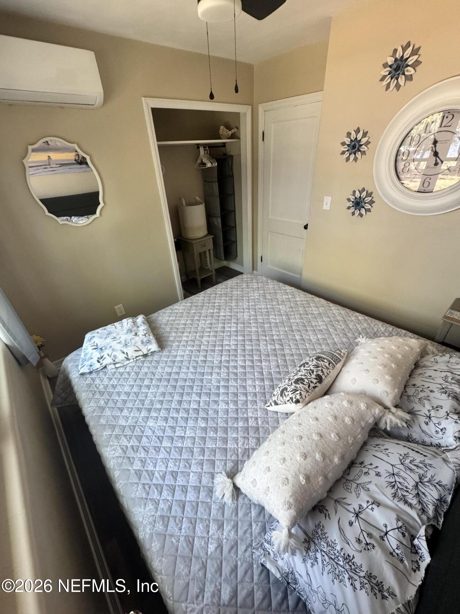 113 Stock Avenue Interlachen, FL 32148 - Photo 16 of 50 a bedroom with a bed and a window