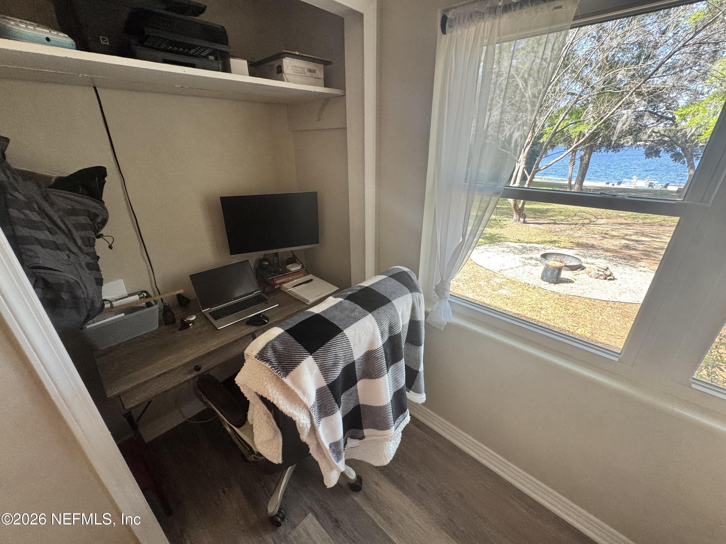 113 Stock Avenue Interlachen, FL 32148 - Photo 22 of 50 a bedroom with a bed and a window