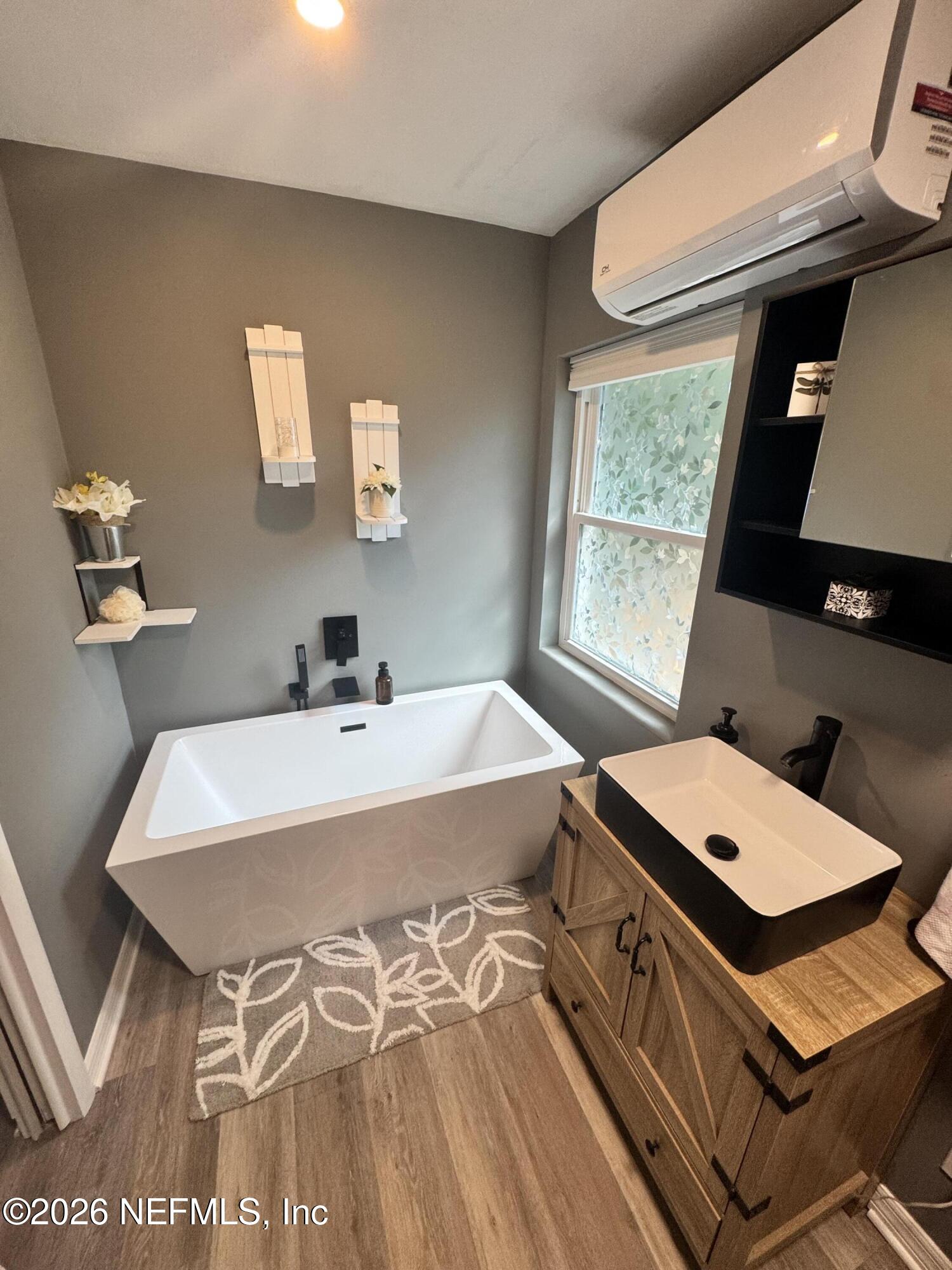 113 Stock Avenue Interlachen, FL 32148 - Photo 24 of 50 a bath room with a bed and a window
