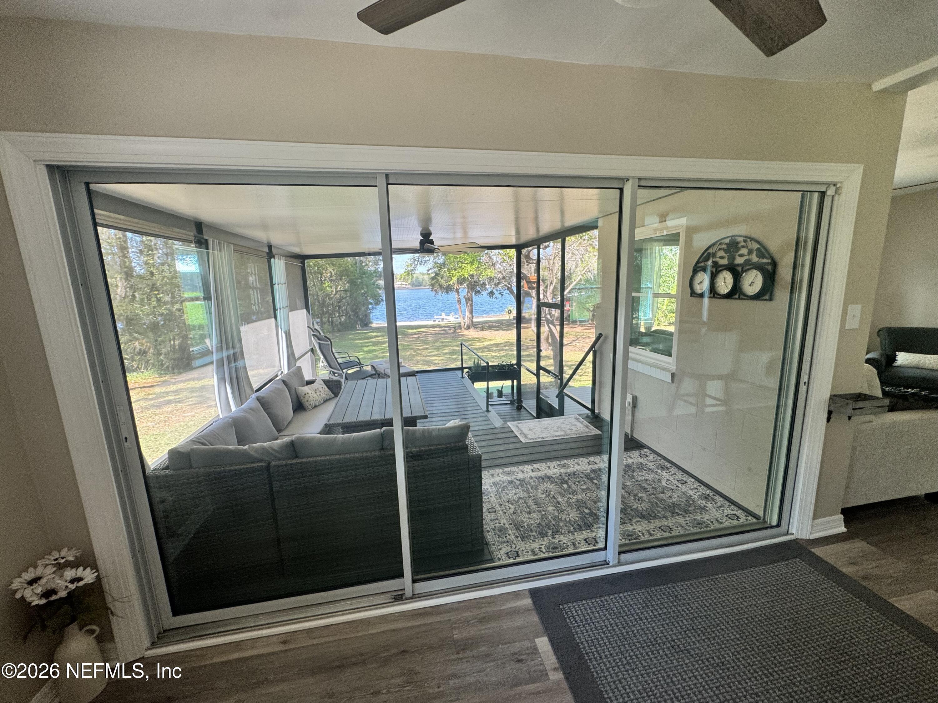 113 Stock Avenue Interlachen, FL 32148 - Photo 25 of 50 a view of a livingroom with wooden floor and furniture