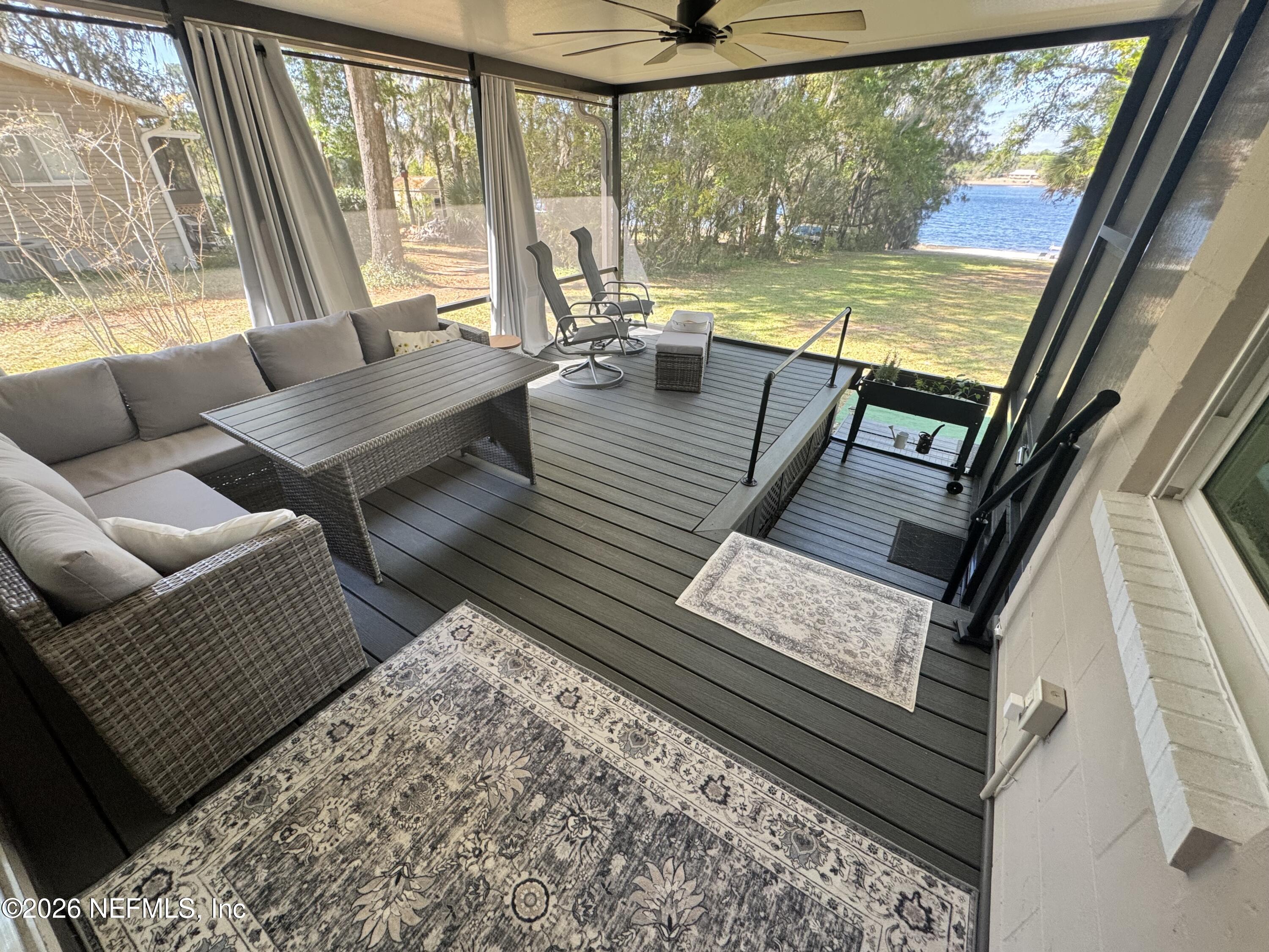 113 Stock Avenue Interlachen, FL 32148 - Photo 26 of 50 a living room with furniture and a large window