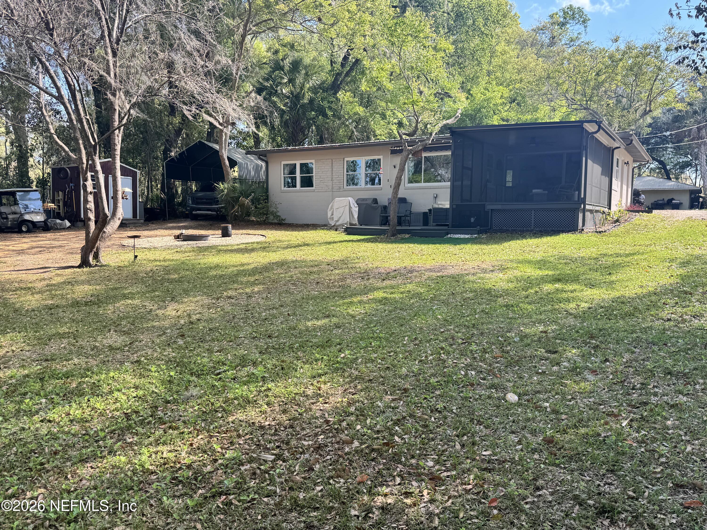113 Stock Avenue Interlachen, FL 32148 - Photo 29 of 50 a house view with swimming pool in front of it