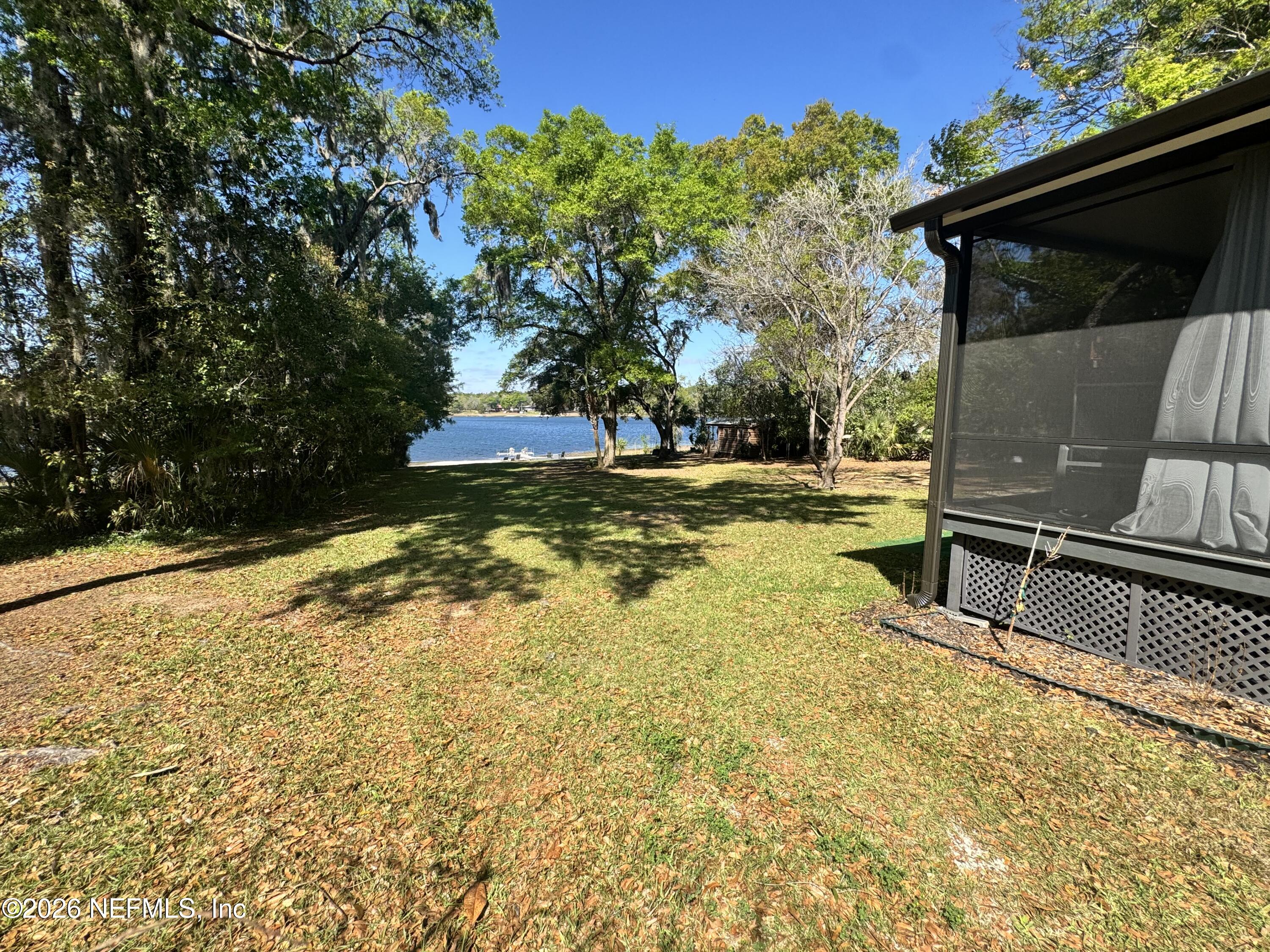 113 Stock Avenue Interlachen, FL 32148 - Photo 30 of 50 a view of a backyard of the house