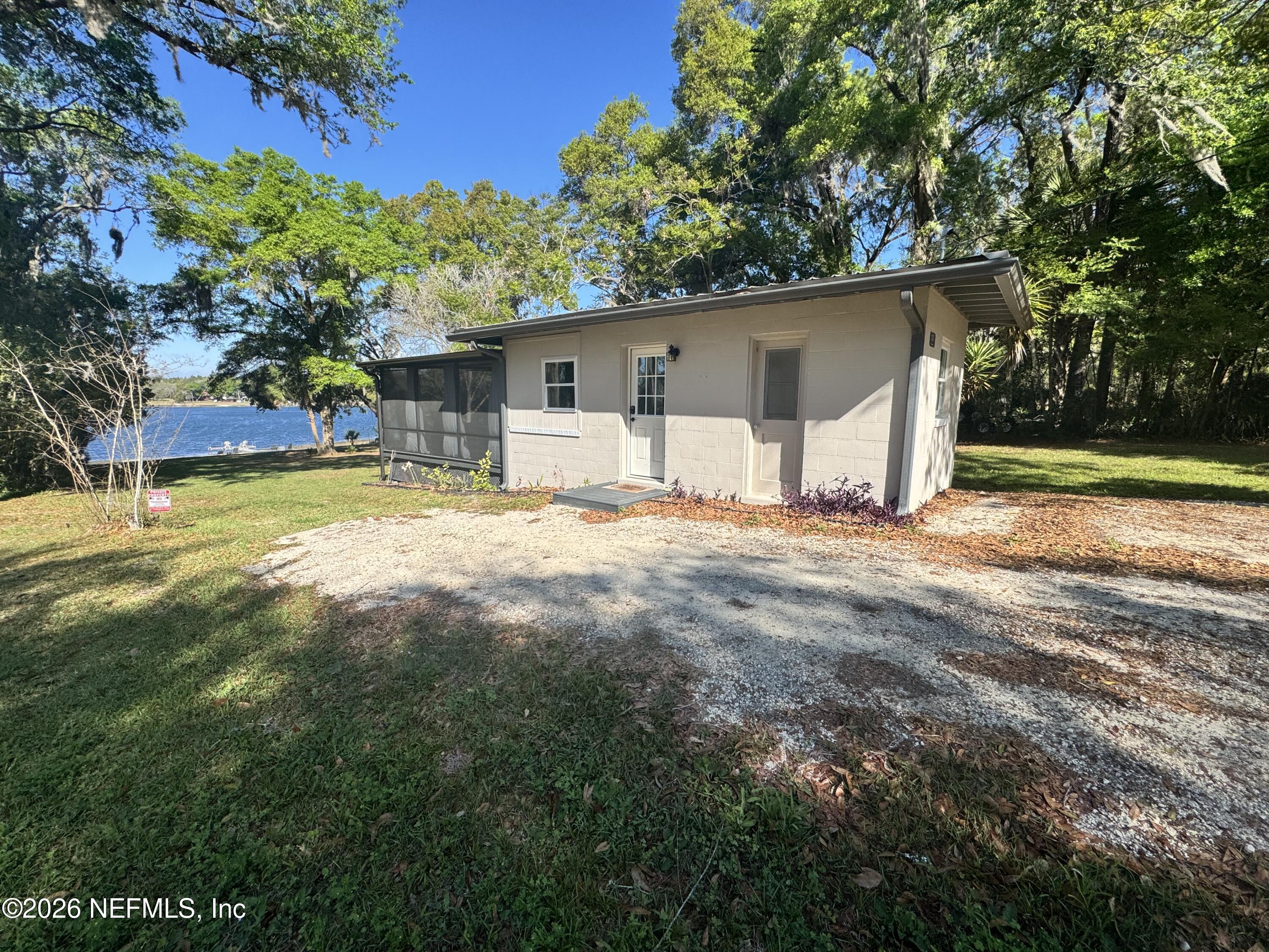 113 Stock Avenue Interlachen, FL 32148 - Photo 3 of 50 a view of a house with a yard and tree