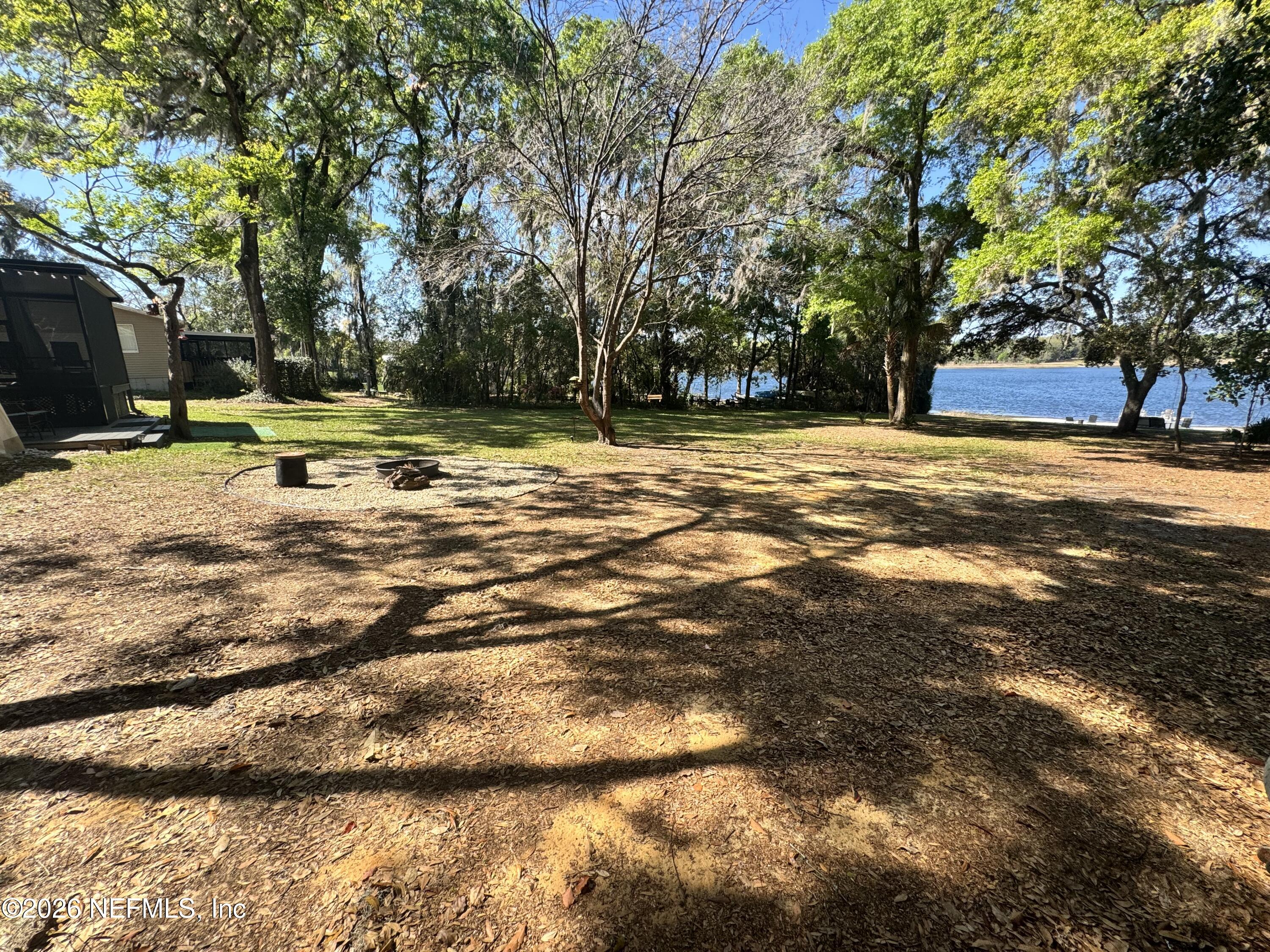 113 Stock Avenue Interlachen, FL 32148 - Photo 36 of 50 a view of swimming pool with trees