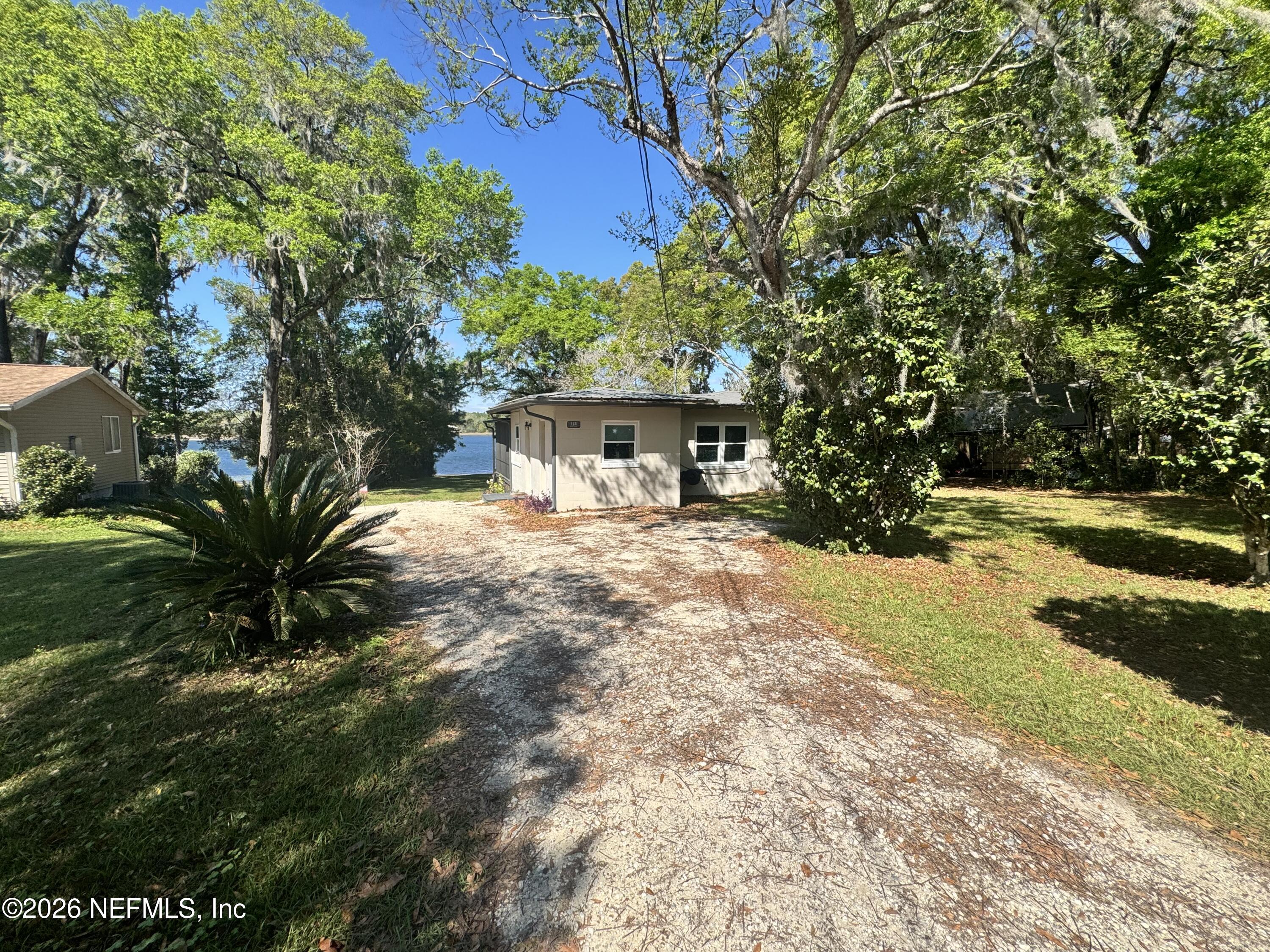 113 Stock Avenue Interlachen, FL 32148 - Photo 4 of 50 a view of a house with a yard and sitting area