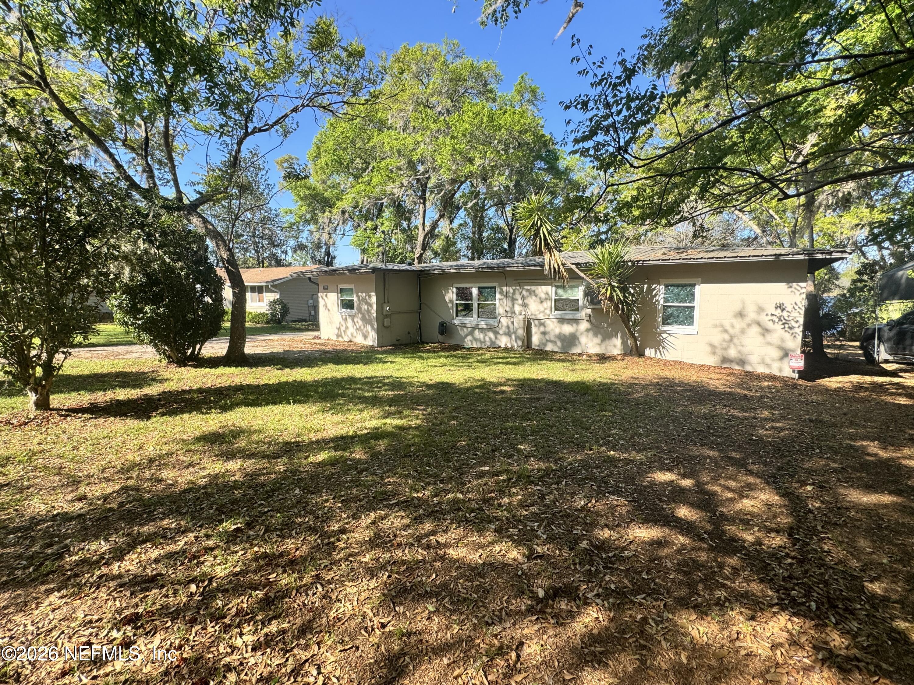 113 Stock Avenue Interlachen, FL 32148 - Photo 5 of 50 a front view of a house with a yard
