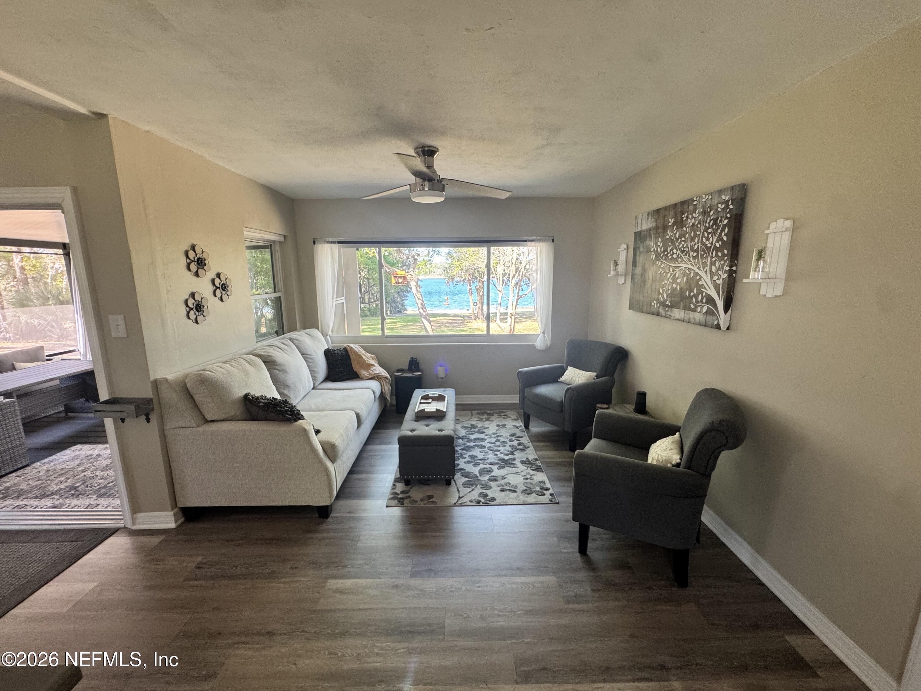 113 Stock Avenue Interlachen, FL 32148 - Photo 10 of 50 a living room with furniture and a large window